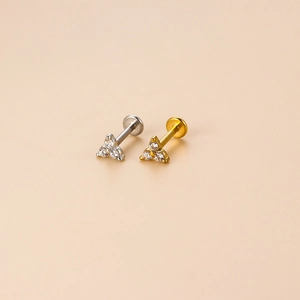 Minimalist stainless steel labret studs with three clear zircons in gold and silver finish