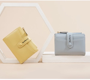 Macro view of light yellow and grey blue matte PU leather wallets on geometric stands