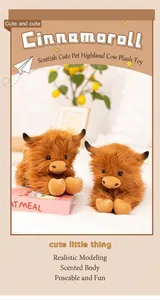 Detail of two plush Scottish Highland cows with fluffy brown fur and cute expressions