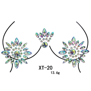 Macro detail of XT-20 iridescent AB resin chest jewels for music festival body art decor