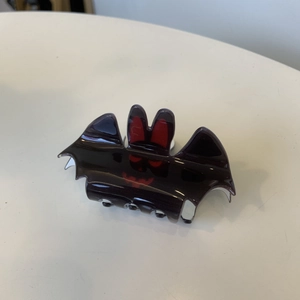 Halloween black bat hair claw clip with red details for women on white background