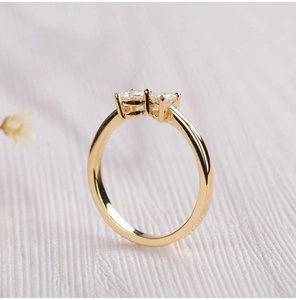 Detail shot of 18k gold plated S925 silver ring featuring heart zircon with dual stones