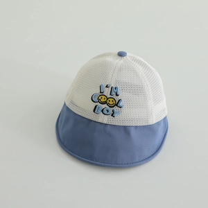 Detail of breathable mesh fabric and embroidery on a navy blue summer sun hat for kids