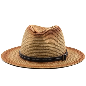 Detailed close-up of gradient woven straw fedora featuring a leather band and silver buckle