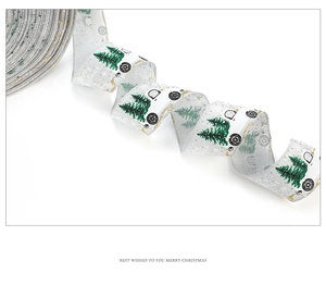 Detail of Christmas ribbon with green trees and car pattern for gift wrapping