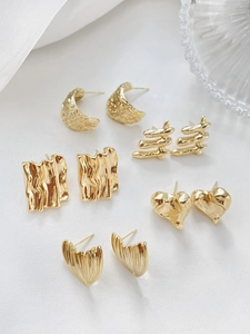 Detail view of various 14k gold plated irregular heart and square DIY earring findings