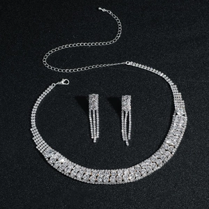 Luxurious silver copper bridal jewelry set with sparkling crystal necklace and drop earrings