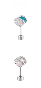 Macro shot of silver shell earring with pink star inlay and purple crystal accents