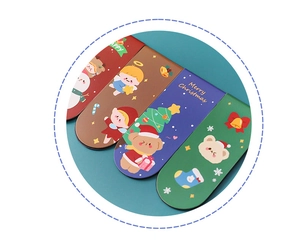 Detailed view of four Christmas magnetic bookmarks with snowman and bear patterns
