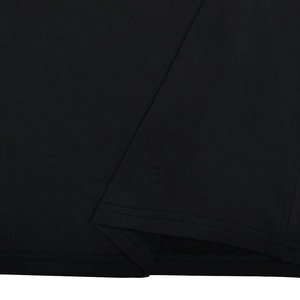 Close-up of high-quality black fabric texture and professional stitching on a dress