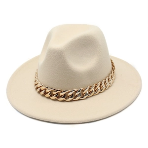 Detailed view of beige jazz felt hat featuring a chunky gold acrylic chain decoration