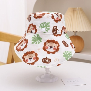 Detail of child sun hat with cartoon lion print, tropical leaves, and adjustable chin strap