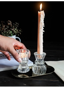 Close-up of vintage ribbed glass candle holders showing detailed vertical embossed patterns