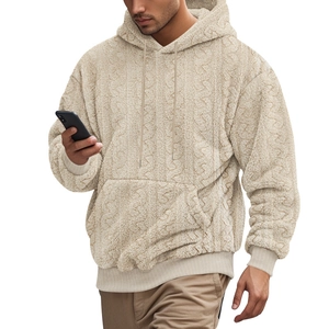 Detail of men's beige hoodie showing teddy fleece texture and cable knit design