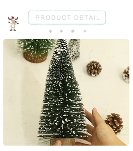 Detail view of mini snow-covered artificial Christmas tree with natural wood base