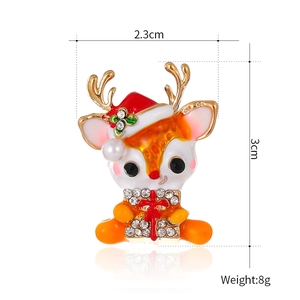 Cartoon Christmas reindeer brooch with red enamel hat and pearl accent in studio view