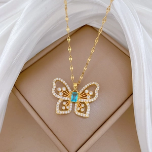 Elegant gold titanium steel necklace with a hollow butterfly pendant and blue crystal