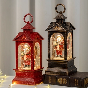 Vintage Christmas snow globe lanterns with Santa Claus figurines and warm LED lighting