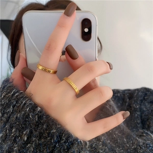 Minimalist gold titanium steel ring with vertical pleated texture for daily fashion