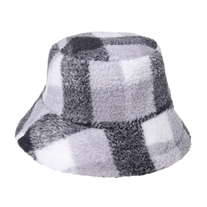 Winter plaid bucket hat made of warm fleece material with black and white grid pattern