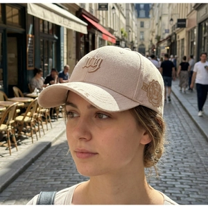 Close-up of textured baseball cap with 3D embroidery and vintage patch detail