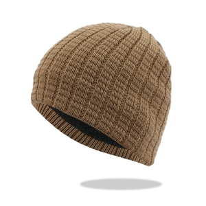 Close-up of brown knit beanie showing wide rib texture and thick black fleece lining