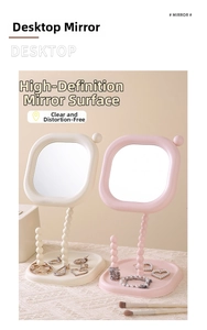 Detail view of cream pearl desktop makeup mirrors in white and pink with jewelry tray