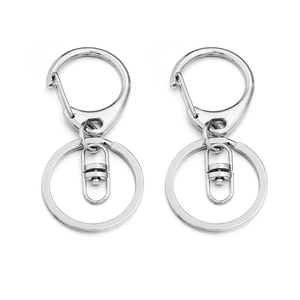 Macro detail of silver D-ring lobster clasps and metal split key rings for DIY jewelry