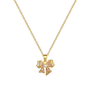 Elegant gold-plated titanium necklace with pink crystal bow and white pearl pendant