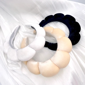 Detailed set of three thick sponge headbands in white, beige, and black soft velvet fabric