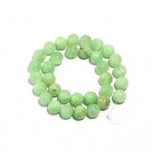 Close-up of high-quality green natural stone round beads for DIY jewelry making
