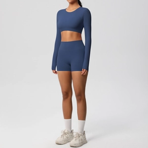 Navy blue seamless yoga set with long sleeve crop top and high waist sports shorts