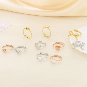 Elegante Herz- und Bogenringe in Gold, Silber und Roségold mit Muschel-Inlay