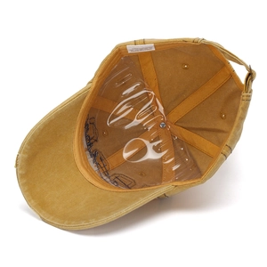 Detail view of cotton baseball cap interior with stitching and adjustable strap