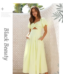 Detail view of lime green midi dress with puff sleeves, cutout front and functional pockets
