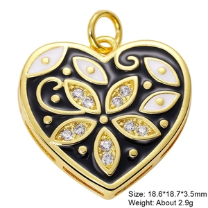 Macro shot of gold-plated heart pendant with black enamel and zircons 18.6x18.7x3.5mm