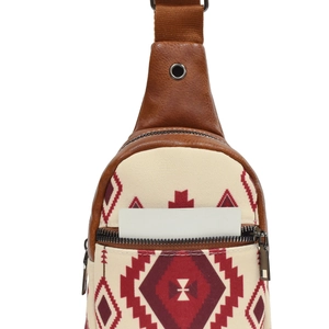 Detail of bohemian canvas crossbody bag with red geometric patterns and brown leather trim