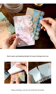 Close-up of vintage hollowed-out lace notepads with elegant gilding and floral patterns