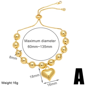 Detail of 18k gold beaded bracelet with 8mm beads, heart charm and adjustable slider