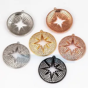 Macro detail of micro-pave star pendants in gold, silver, rose gold, and black finishes