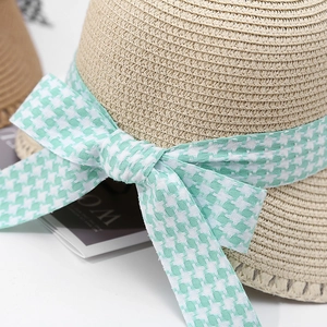 Women's straw sun hat with large brim and mint green houndstooth ribbon bow for summer beach