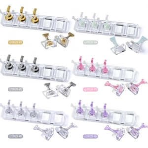 Macro detail of acrylic nail display stand with six colorful magnetic chess-style holders