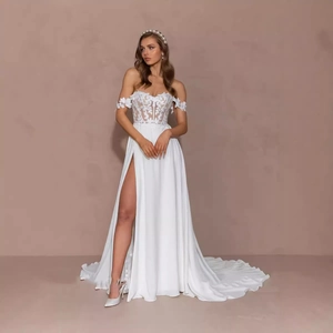 Elegant white lace mermaid dress with deep V-neck, high slit, and long trailing train