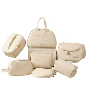 7-piece cream woven PU makeup bag set with gold zippers for travel organization