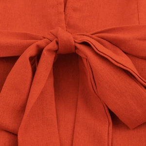 Elegant brick red V-neck linen maxi dress featuring a waist-defining bow tie detail