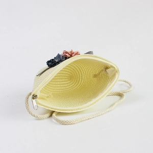 Kids beige straw crossbody bag with floral accents and silver zipper closure