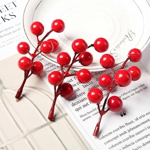 Artificial red holly berries on stems for Christmas DIY wreaths and festive floral decor