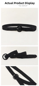 Detail of black woven elastic belt featuring a round buckle and textured braid pattern