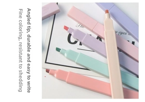 Close-up of pastel chisel tip highlighters in soft macaron colors for school supplies