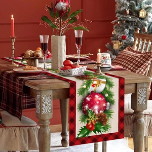 Christmas table runner with red black plaid pattern and festive holiday ornaments
